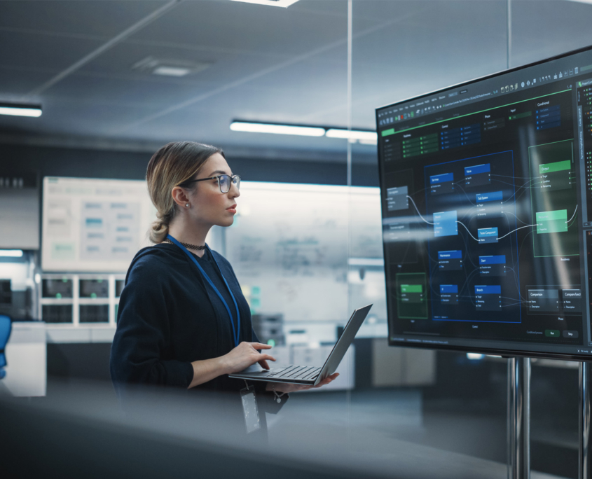 Engineer Working On Computer In A Technological Office Environment 1