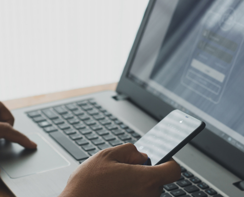 Worker In Office Using Phone For 2fa